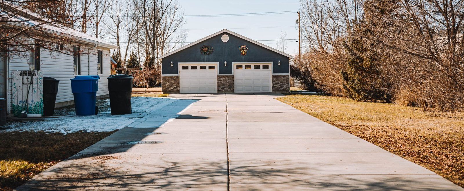 The same driveway bright and clean after pressure washing