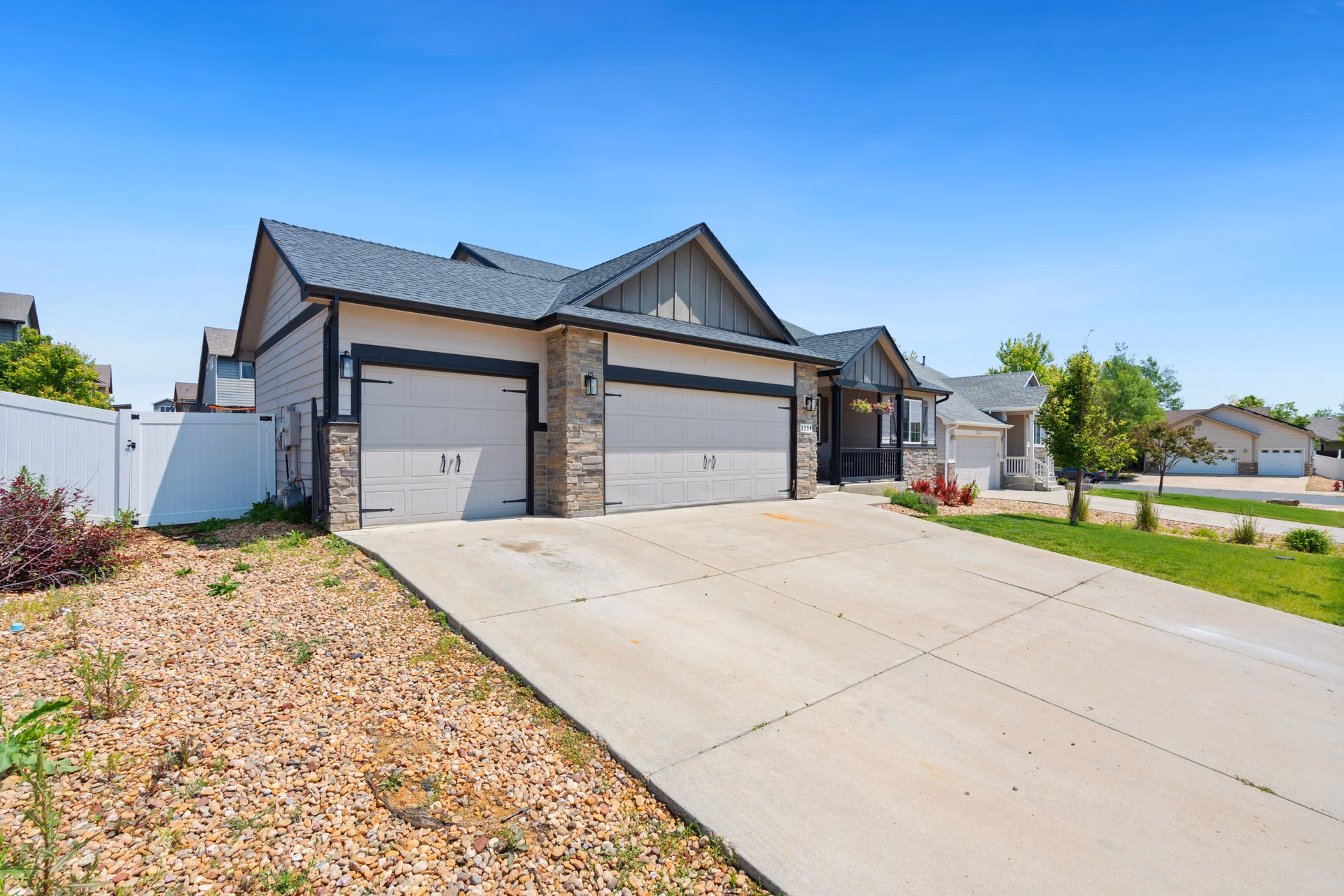 Bright clean driveway and garage apron in front of a home